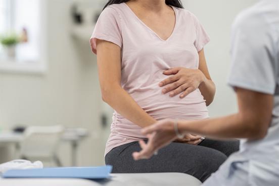 A pregnant woman is seen at an appointment