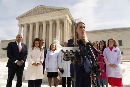 Erin Hawley speaking in front of the Supreme Court after FDA oral arguments