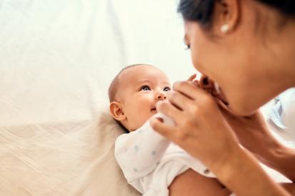 baby looking at mother