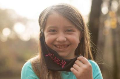 When Lydia Booth went to school wearing her favorite 'Jesus Loves Me' mask, she just wanted to share the love of Jesus with those around her.