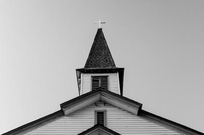 Black-and-white photo of a church steeple