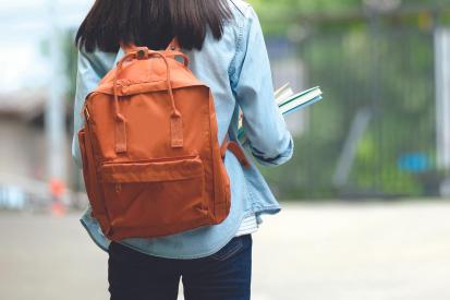 Teenage girl with orange backpack