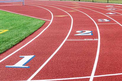 An all-weather running track is seen on a sunny day