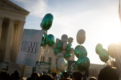 Signs and balloons reading 'create freely' are seen outside of the U.S. Supreme Court in Washington, D.C.