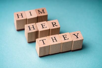 Pronouns are spelled out in wooden letter blocks 