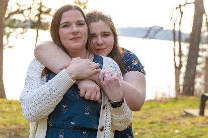 ADF's clients (a mother and daughter) from the Kettle Moraine School District are seen on the edge of a lake