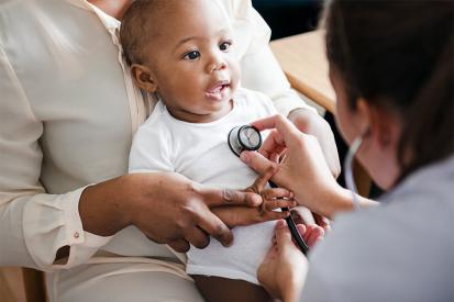 Pediatrician doctor doing a checkup on a baby