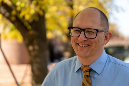 French teacher Peter Vlaming is seen standing outside smiling in the sun