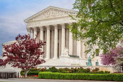 The U.S. Supreme Court is seen with trees in the foreground