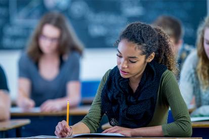 Female student writing in class