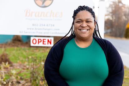 Jean Marie Davis in front of Branches Pregnancy Resource Center sign