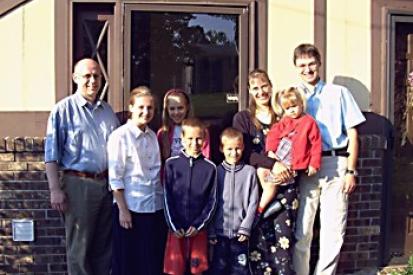 The Romeike Family in front of their home