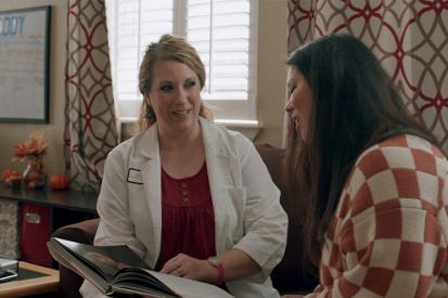 Chelsea Mynyk (L), licensed nurse practitioner and certified nurse midwife, owner of Castle Rock Women's Health, with a patient.