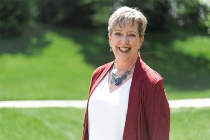 Deb Figliola smiling with grass background