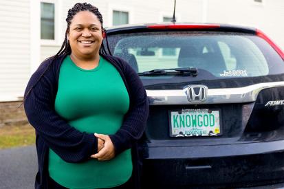 Jean Marie Davis of Branches Pregnancy Center stands next to her car smiling