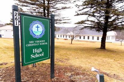 A sign for Mid Vermont Christian School is seen on campus