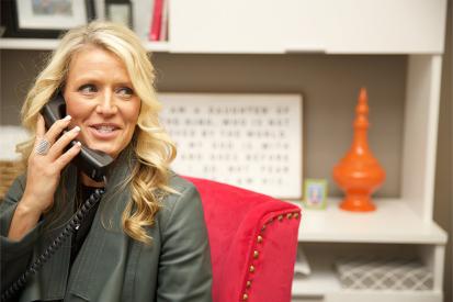 Pregnancy center director Heidi Matzke sits at her desk on the phone