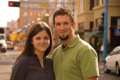 Jon and Elaine Huguenin stand on the side of a street