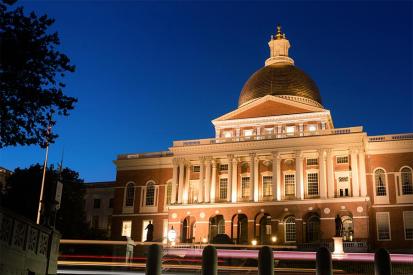 The Massachusetts State House is seen in Boston at night