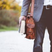 Man walking with Bible and briefcase