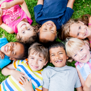 Children lying on grass