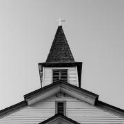 Black-and-white photo of a church steeple