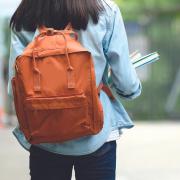 Teenage girl with orange backpack