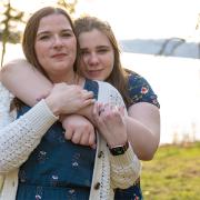 ADF's clients (a mother and daughter) from the Kettle Moraine School District are seen on the edge of a lake