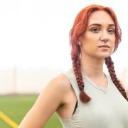 Selina Soule at an indoor track field