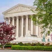 The U.S. Supreme Court is seen with trees in the foreground