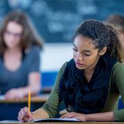 Female student writing in class