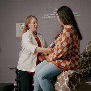 Chelsea Mynyk (L), licensed nurse practitioner and certified nurse midwife, owner of Castle Rock Women's Health, with a patient.