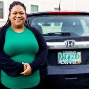 Jean Marie Davis of Branches Pregnancy Center stands next to her car smiling