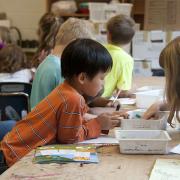 Young Students Drawing and Coloring in Class