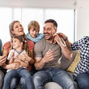 A group of family members laughing together