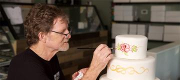 Jack Phillips of Masterpiece Cakeshop decorates a custom cake