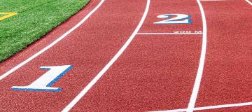 An all-weather running track is seen on a sunny day