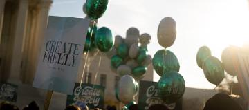 Signs and balloons reading 'create freely' are seen outside of the U.S. Supreme Court in Washington, D.C.