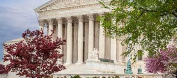 The U.S. Supreme Court is seen with trees in the foreground