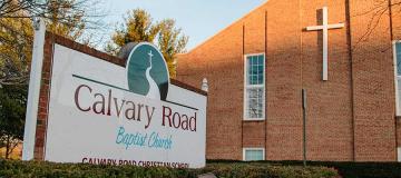 Calvary Road Baptist Church sign and building with cross