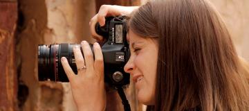 Elaine Huguenin is seen taking photos