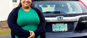 Jean Marie Davis of Branches Pregnancy Center stands next to her car smiling