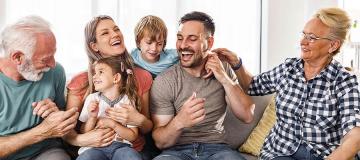 A group of family members laughing together