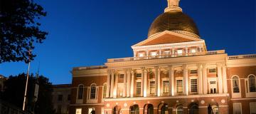 The Massachusetts State House is seen in Boston at night