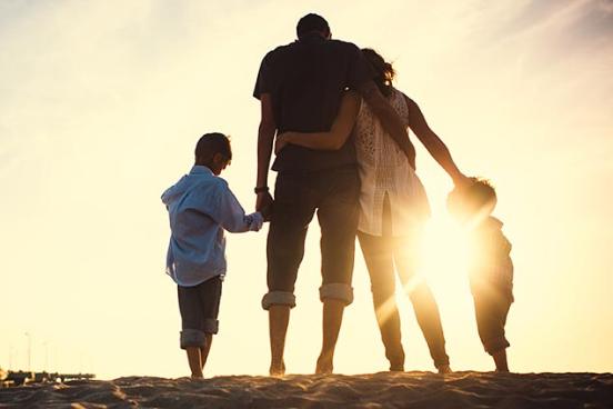 Family walking on the beach