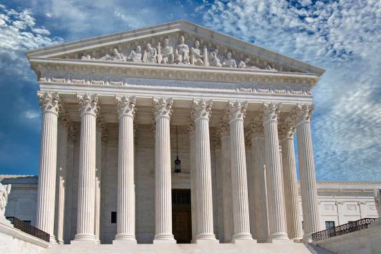 Supreme Court building with clouds