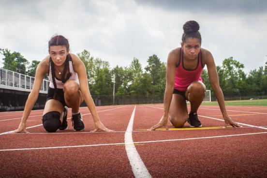 Selina Soule and Alanna Smith at the starting line of a race track