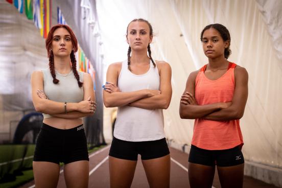 Selina Soule, Chelsea Michell, and Alanna Smith standing on the track serious