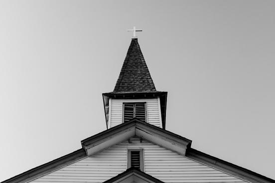 Black-and-white photo of a church steeple