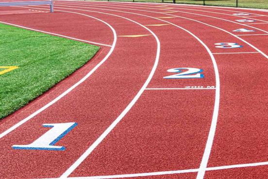 An all-weather running track is seen on a sunny day